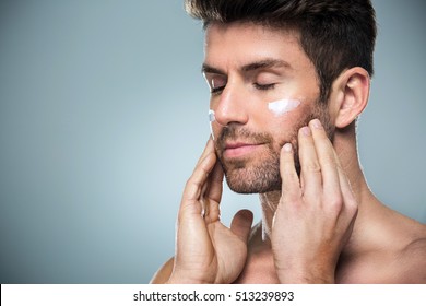 Man Applying Face Cream
