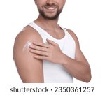 Man applying sun protection cream onto his shoulder against white background, closeup
