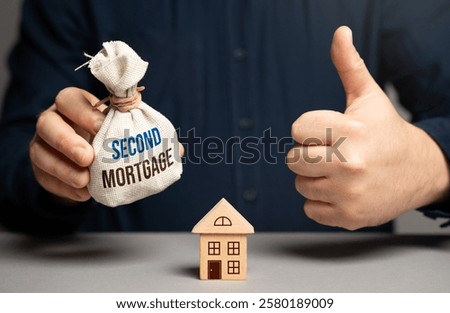 The man approves of taking out a second mortgage. Buying a house. Financial strategy, home equity, and refinancing. Credit management.