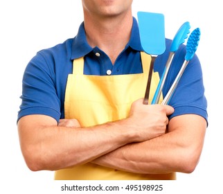 Man In Apron With Cooking Utensils On White