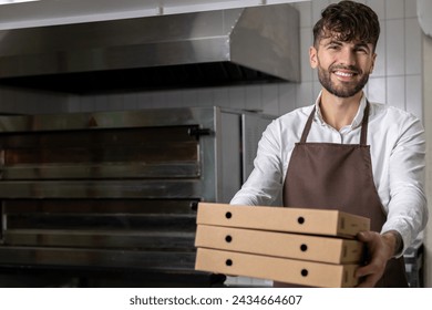 Man in apron holding pizza boxes involving preparation and delivery of tasty Italian meals - Powered by Shutterstock