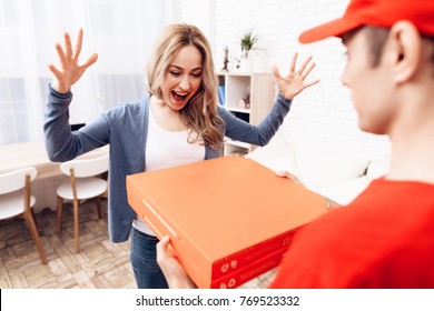 A man of Arab nationality works on the delivery of pizza. The girl ordered the delivery of pizza. Pizza deliveryman brought an order to the house.