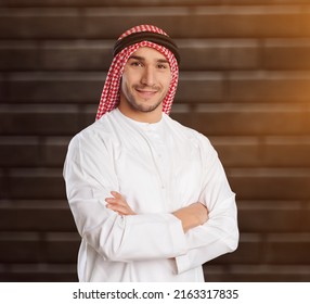 Man In Arab Qatari Dress On Stone Background