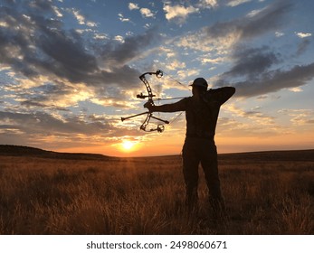 Man Archery Hunting in the Desert Sunset - Powered by Shutterstock