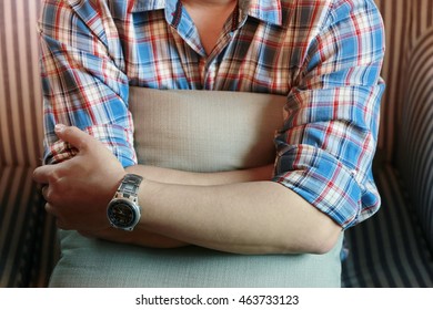 Man Arm Hug Pillow Background With Warming And Lonely Feeling , Man Sitting On Sofa With Pillow  Waiting. Cross One's Arm