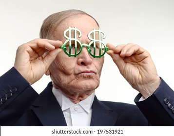 Man Arranging His Dollar Sign Glasses 