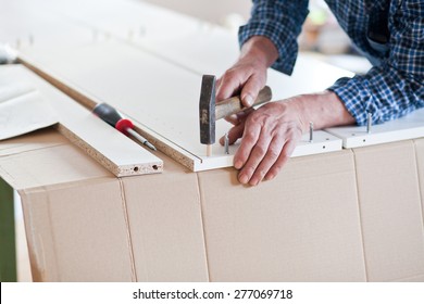 Man Assembling Flat Pack Furniture