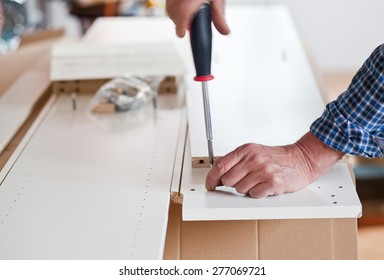 Man Assembling Flat Pack Furniture