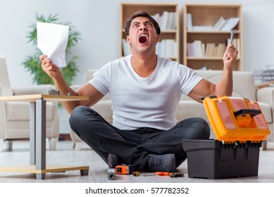 Man Assembling Furniture At Home