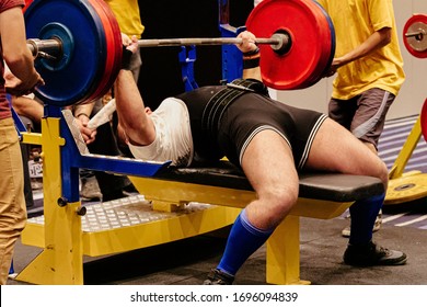 man athlete bench press exercise in powerlifting competition - Powered by Shutterstock