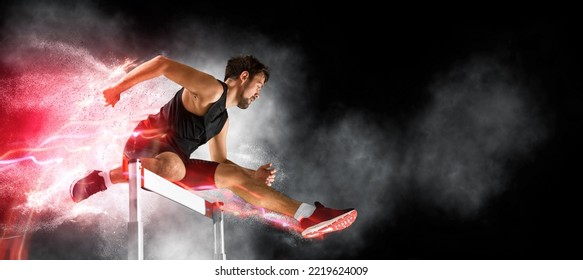 Man athlete at hurdle race, jumping over the last hurdle. Red neon background. Sport banner - Shutterstock ID 2219624009
