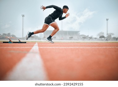 Man, athlete and ready for race on track with practice, training or exercise for competition. Black person, runner and fast with dedication, determination and passion on face with speed for sport - Powered by Shutterstock