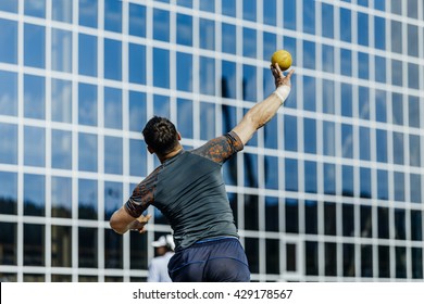 man athlete shot put at competition - Powered by Shutterstock