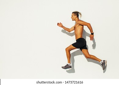 Man athlete sprinting on the street