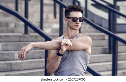 Man Athlete Stretching Arm. Sport Warmup Of Athlete Man. Warmup And Stretching. Man Warming Up