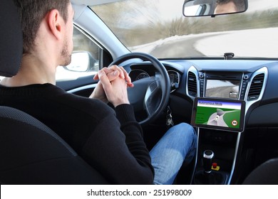 A man in a Autonomous driving  test vehicle