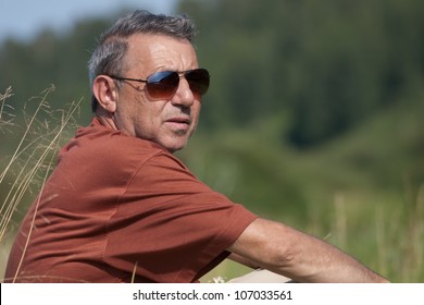 The Man Of Average Years In Sunglasses