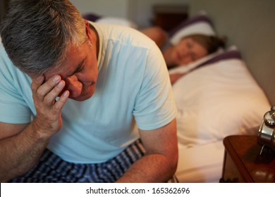 Man Awake In Bed Suffering With Insomnia - Shutterstock ID 165362696