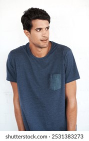 Man, awkward or studio expression by white background for new university, college or school as freshman. Insecure body language, nervous or social anxiety for thinking student with doubt on backdrop