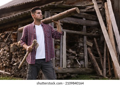 Man with ax and log near wood pile outdoors - Powered by Shutterstock