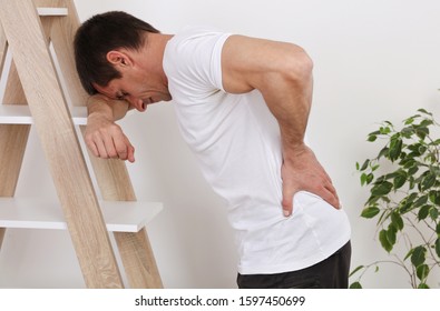 Man With Back Pain. Muscle Spasm, Rheumatism. Pain Relief, Concept.