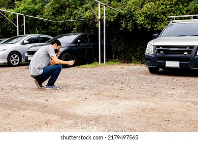 Man In The Back Sits Looking For His Own Car Parked In A Residential Parking Lot And Can't Find It : Car Theft And Lost Car Insurance In Unsafe Place Without CCTV.