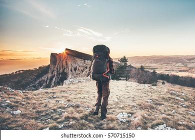 Man With Backpack Hiking In Mountains Travel Lifestyle Success Concept Adventure Active Vacations Outdoor Mountaineering Sport Sunset Landscape