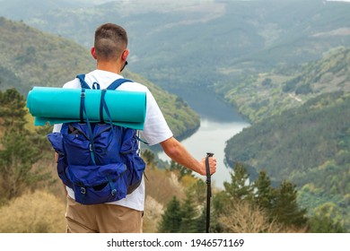 man with backpack in the mountain