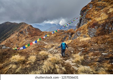 Man with backpack on the trail at the Mardi Himal Treck of Himalaya Mountains in Nepal