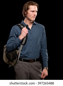 Man with backpack.  Studio shot over black.