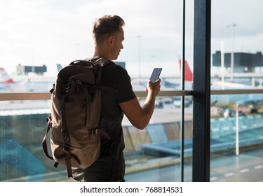 Man With Backpack Walking In Airport