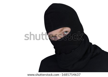 man in balaclava looks suspiciously close-up portrait isolated on a white background