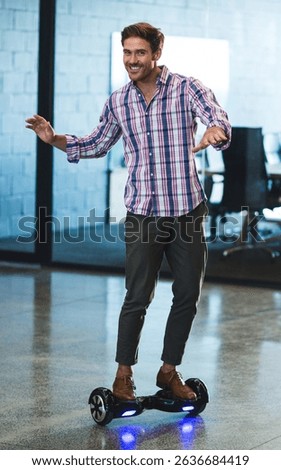 Man balancing on hoverboard inside modern office on polished concrete floor with glowing LED lights. Technology, innovation, startup, mobility, futurism, workspace, dynamic