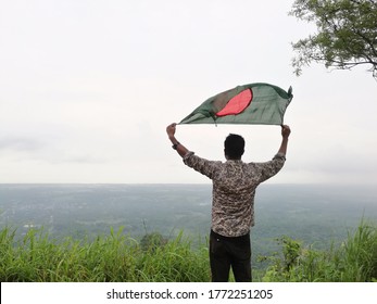 A Man With Bangladeshi Flag On The Hand