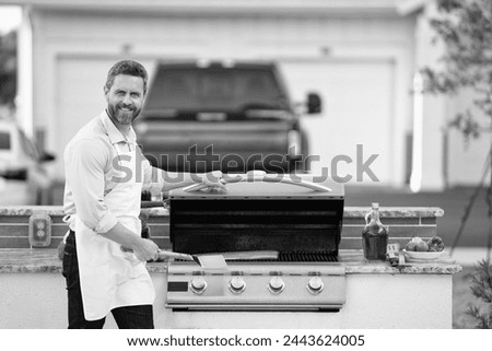 man barbecuing trout fillet, copy space banner. man barbecuing trout fillet outdoor.