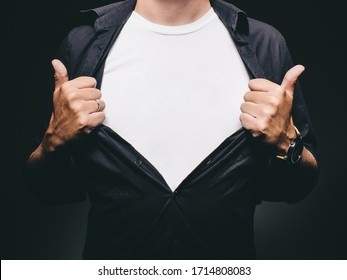 Man Baring Chest Doing Superman Superhero Pose Revealing Blank T-shirt With Copy Space