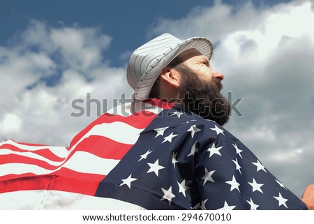 man with a beard with American flag
