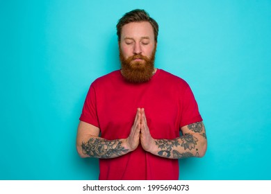 Man with beard asks to be forgiven and prays