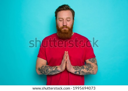Man with beard asks to be forgiven and prays