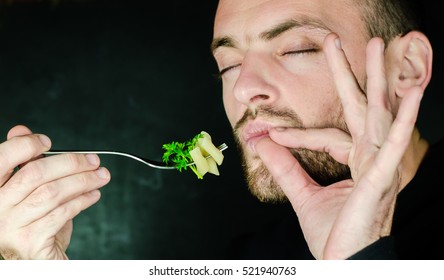 Man With A Beard Eating Italian Pasta