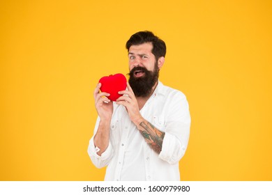 Man bearded hipster hold red heart toy. Medicine concept. Listen to your heart. Health Check helps understand risk factors for heart disease and estimate how likely have attack or stroke next years.
