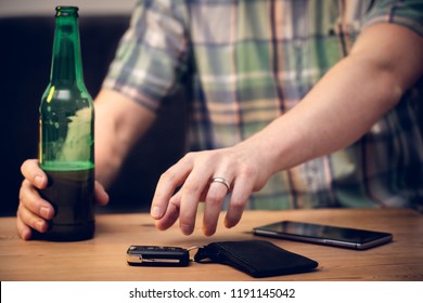 Man With Beer Grabbing Car Keys To Drive