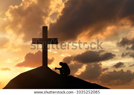 man before the cross, praying and worshiping the Lord God