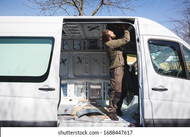 Man Beginning Work On His Self Made Camper Van