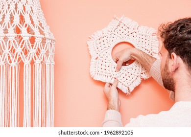 Man From Behind Making A Macrame Tapestry On Beige Background