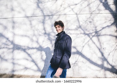 man behind the shadows of tree
