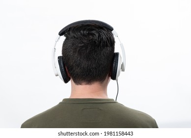 man from behind wearing white headphones on white background - Powered by Shutterstock