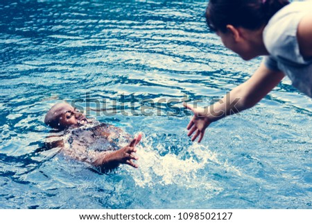 Man being rescued from the water