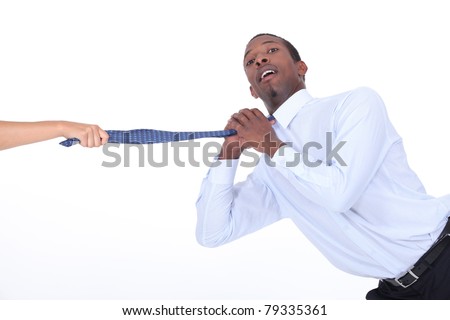 Man being yanked off camera by his tie