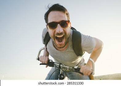 Man With Bicycle Having Fun. Retro Style Image.